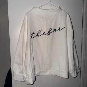 The Bar Cream Cowl Neck Sweater with Black Script